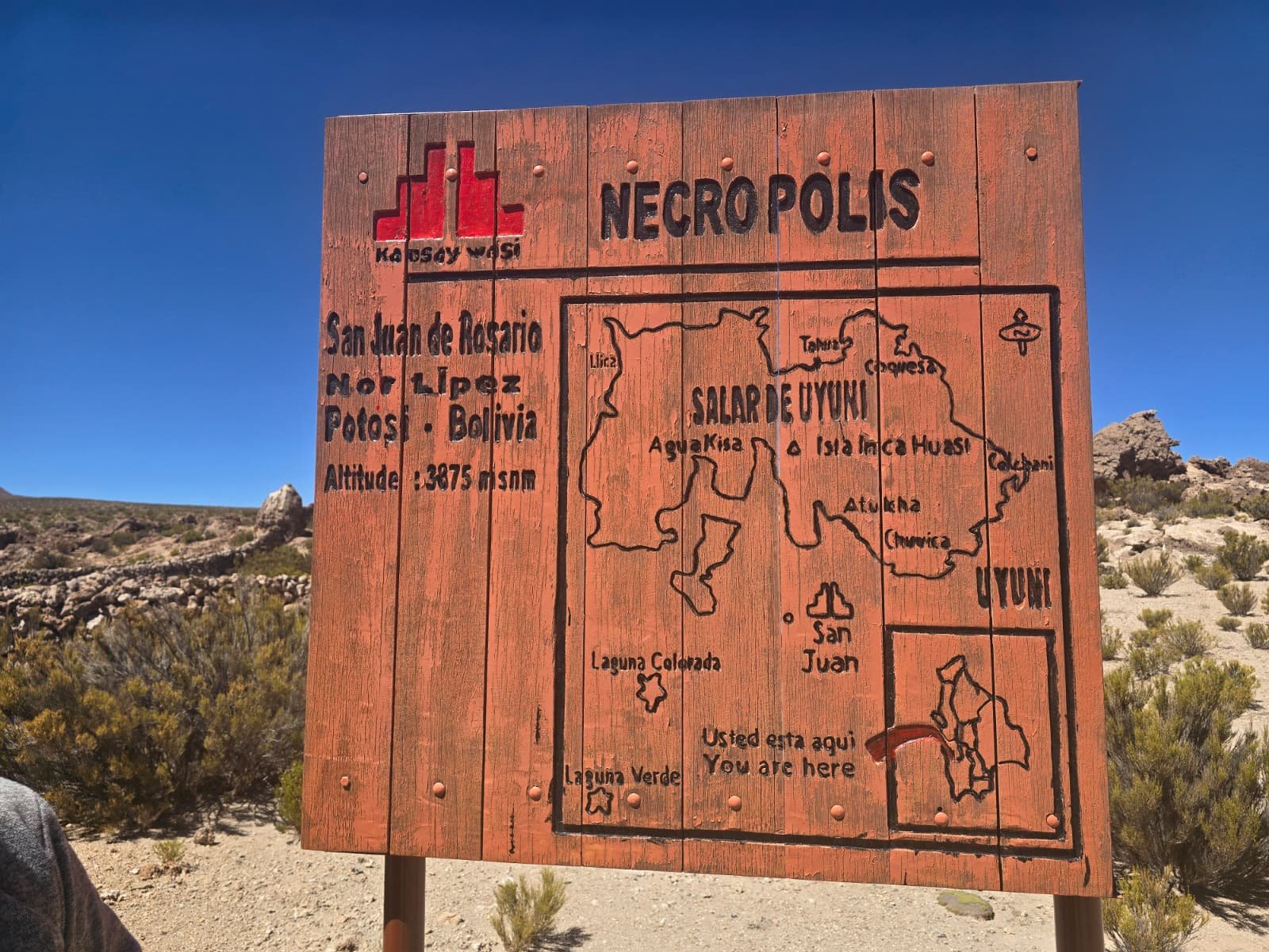 Kausay Wasi necropolis sign with Salar de Uyuni circuit map